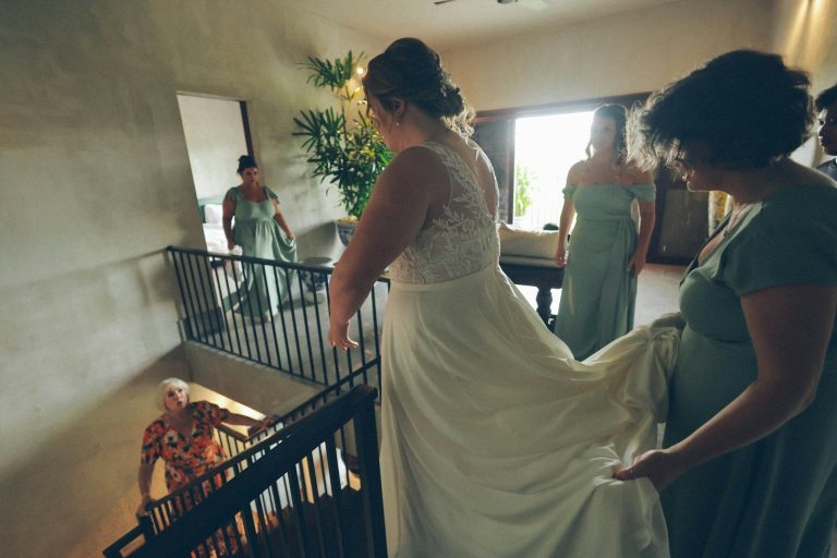 Bride and bridesmaids on staircase